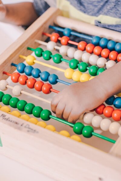 Integrating Movement of fine motor skills with colourful abacus with educational toys and games