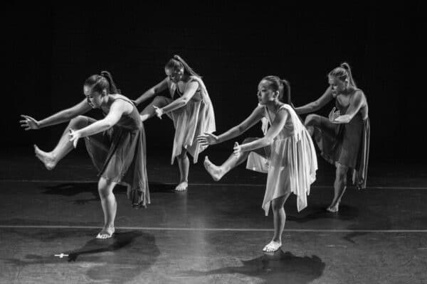Dance class performing a contemporary expressive routine